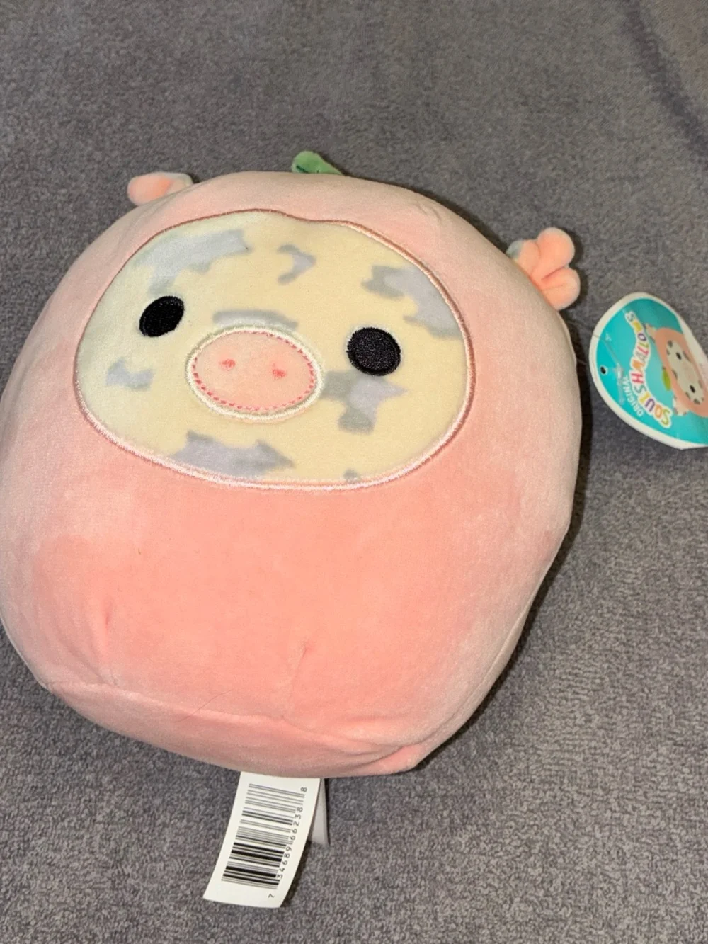 Squishmallows Rosie Pink Pig in a peach